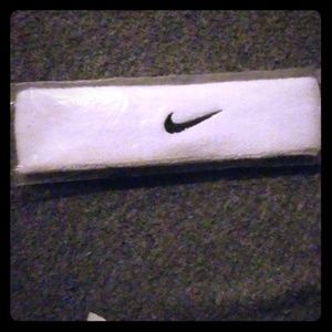 Nike head band still in package , never worn ,just